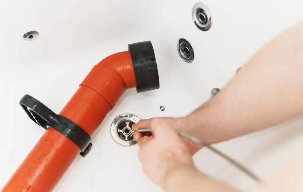 Snaking a clogged bathtub drain
