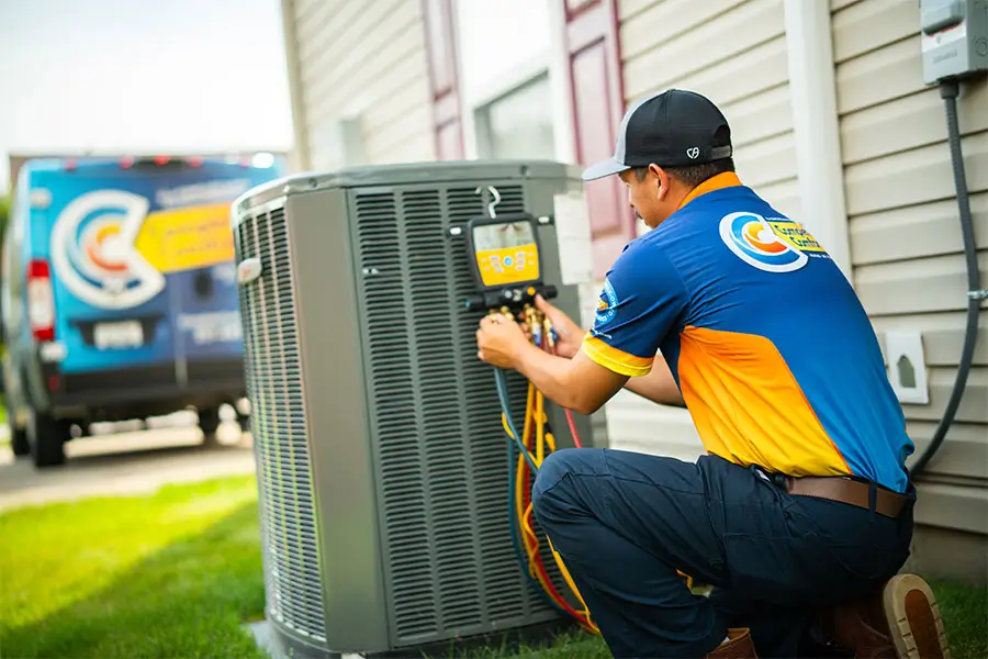 Technician performing AC repair in Greenwood, IN