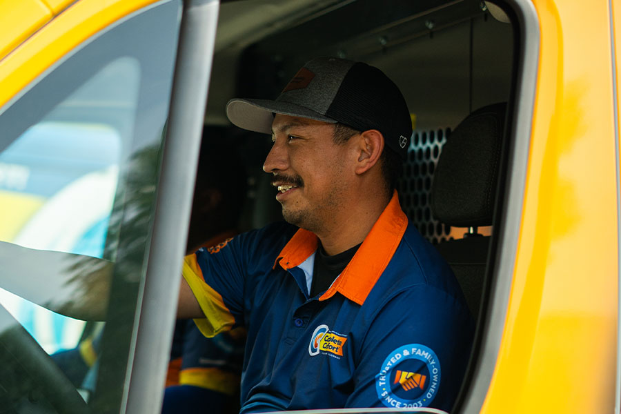 AC repair technician inside a service van in Greenwood, IN